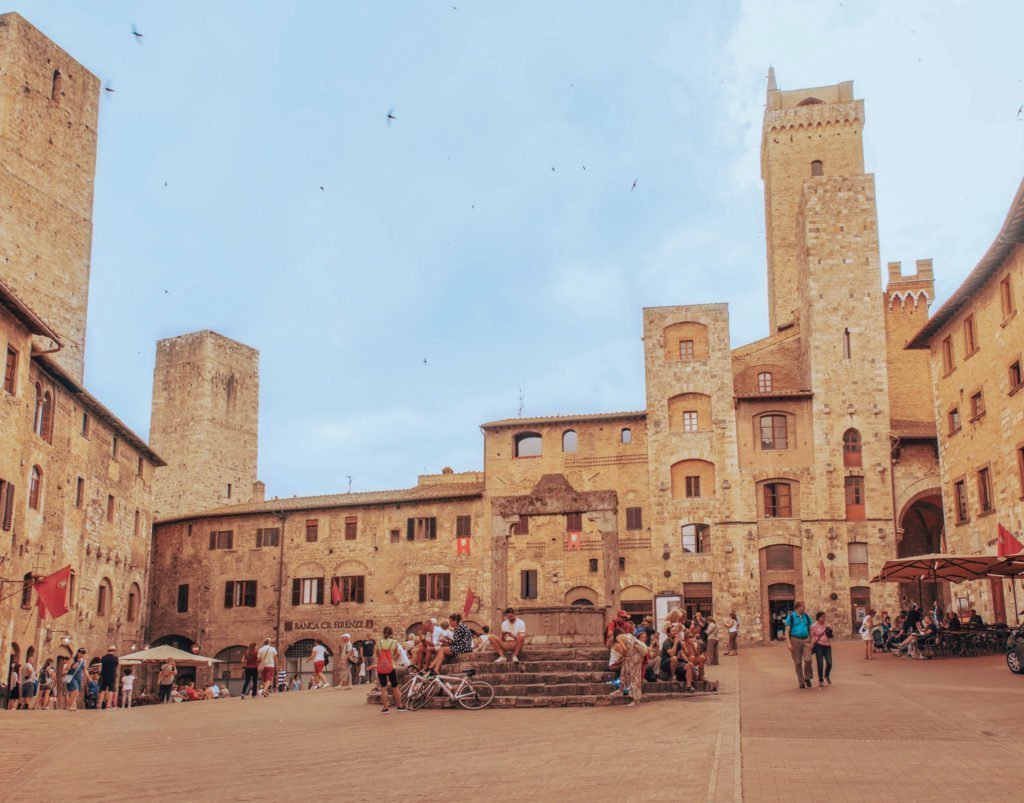 15 Amazing Day Trips From Florence, Italy 16 A group of people in front of a stone building