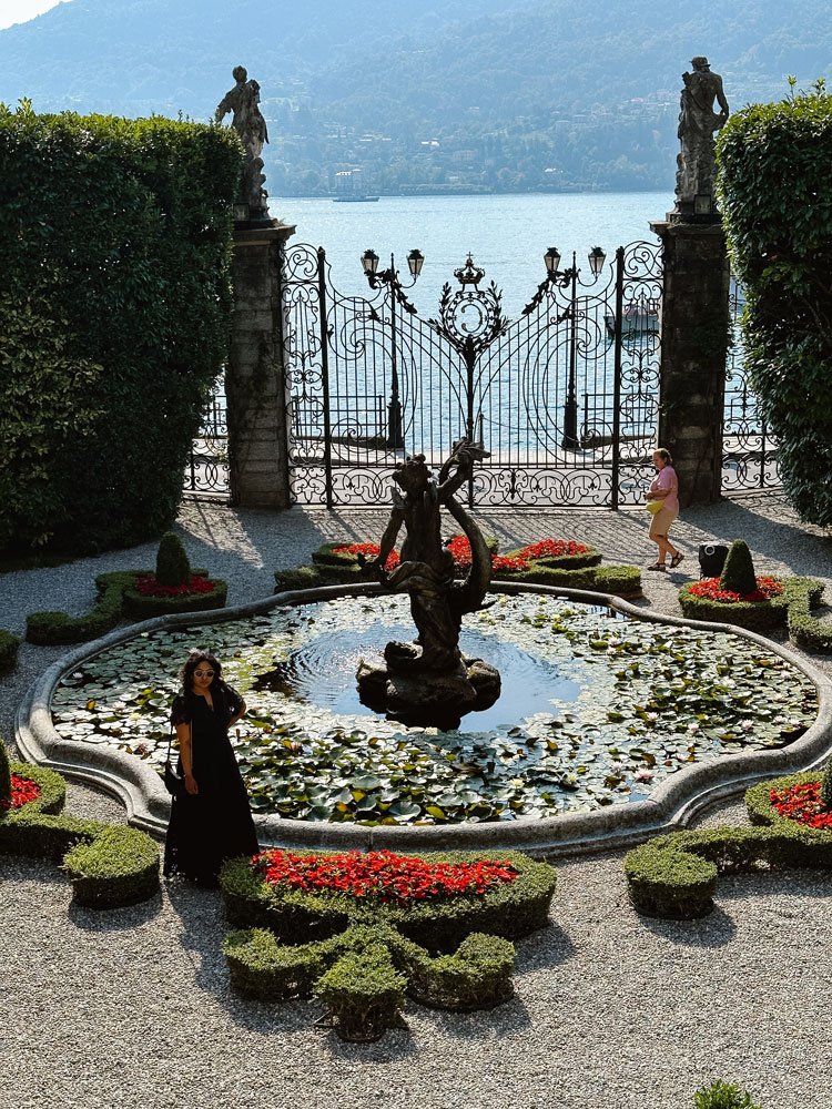 2 Perfect Days in Lake Como: Itineraries & tips 38 Woman watching views of lake Como through beautiful gardens