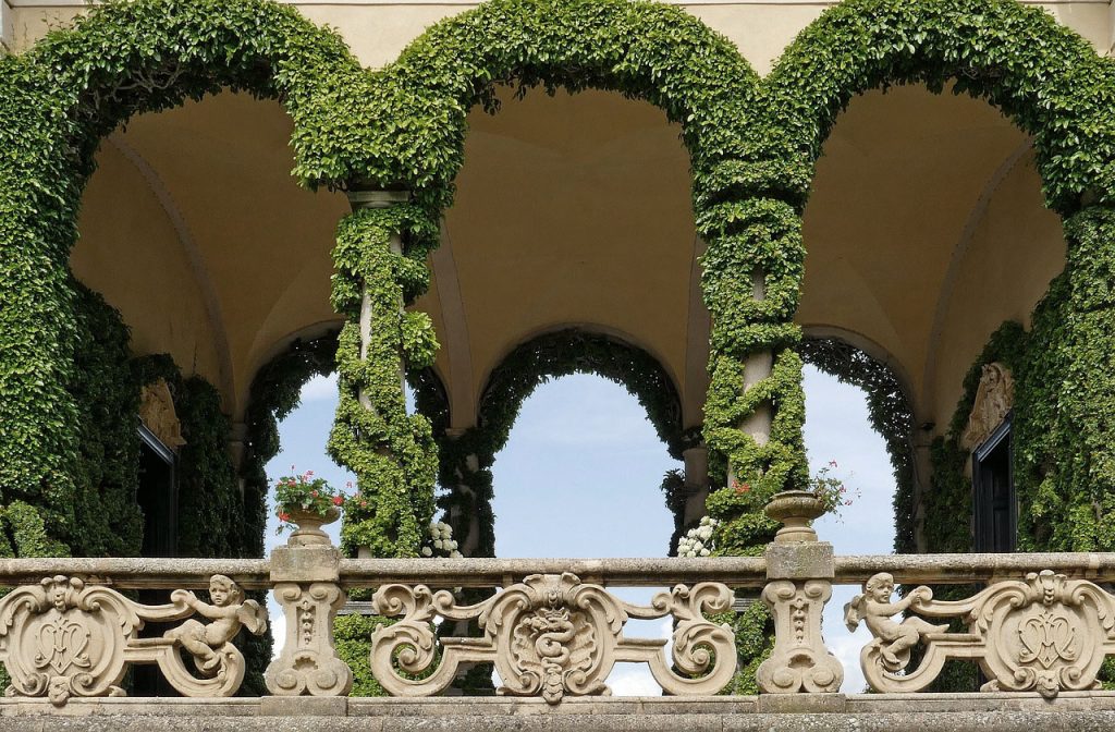 30 Best Instagram Spots In Lake Como 34 Beautiful arches covered in green creeper plants in Villa Balbianello, Lake Como